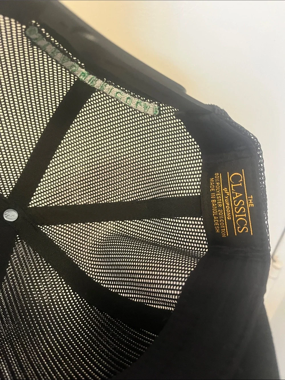 Extracurricular Black Mesh Trucker Cap with White Embroidered Logo